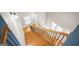 View of a beautiful wood staircase with white trim and black railing at 3451 Fairway Dr, College Park, GA 30337