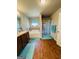 Well-lit bathroom features a soaking tub, shower with curtain, and double vanity at 301 Leland Ct, Mcdonough, GA 30253