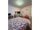 Bright bedroom featuring pink walls, carpet and colorful unicorn patterned bedspread at 301 Leland Ct, Mcdonough, GA 30253
