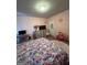 Bright bedroom featuring pink walls, carpet and colorful unicorn patterned bedspread at 301 Leland Ct, Mcdonough, GA 30253
