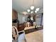 Elegant dining area with wooden chairs and a view into the kitchen at 301 Leland Ct, Mcdonough, GA 30253