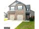 Charming two-story home featuring a brick and siding facade, two-car garage, and a well-maintained lawn at 301 Leland Ct, Mcdonough, GA 30253