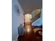 Inviting foyer with hardwood floors, decorative mirror, and staircase access at 301 Leland Ct, Mcdonough, GA 30253