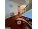 Welcoming foyer with hardwood floors, decorative mirror, and staircase access at 301 Leland Ct, Mcdonough, GA 30253