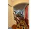 Inviting hallway with hardwood floors, decorative rug, and staircase in view at 301 Leland Ct, Mcdonough, GA 30253