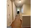 Hallway features neutral walls, plush carpet and access to multiple rooms at 301 Leland Ct, Mcdonough, GA 30253