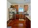 Traditional kitchen with stainless steel appliances, wood cabinets, and a tile backsplash at 301 Leland Ct, Mcdonough, GA 30253