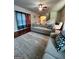 Inviting living room with a comfortable sofa, ceiling fan, and stylish decor at 301 Leland Ct, Mcdonough, GA 30253
