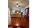 Comfortable living room with a fireplace, ceiling fan, and hardwood floors at 301 Leland Ct, Mcdonough, GA 30253