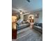 Open living room with hardwood floors, neutral-toned sofas, and a ceiling fan at 301 Leland Ct, Mcdonough, GA 30253