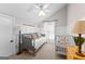 Comfortable bedroom with a daybed, crib, and neutral decor creating a serene and inviting atmosphere at 654 Cannon Rd, Sharpsburg, GA 30277
