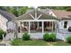 Exterior view of covered patio with comfortable seating and dining, perfect for outdoor living at 654 Cannon Rd, Sharpsburg, GA 30277
