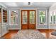 Beautiful french doors and plenty of natural light create a warm and inviting entryway at 654 Cannon Rd, Sharpsburg, GA 30277