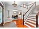 Grand foyer featuring a staircase, columns, and a view into the formal dining room at 654 Cannon Rd, Sharpsburg, GA 30277