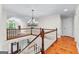 Elegant foyer featuring hardwood floors, a chandelier, and staircase at 654 Cannon Rd, Sharpsburg, GA 30277