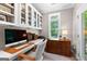 Bright home office space with custom built-in shelving and natural light at 654 Cannon Rd, Sharpsburg, GA 30277