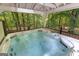 Close-up of a hot tub on a covered deck surrounded by lush greenery offering a relaxing oasis at 654 Cannon Rd, Sharpsburg, GA 30277