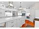 Gourmet kitchen features white cabinetry, stainless appliances, and a large center island at 654 Cannon Rd, Sharpsburg, GA 30277