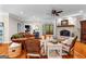 Comfortable living room featuring a brick fireplace, hardwood floors, and cozy furnishings at 654 Cannon Rd, Sharpsburg, GA 30277