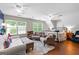 Spacious main bedroom features hardwood floors, a plush rug, and comfortable seating area at 654 Cannon Rd, Sharpsburg, GA 30277