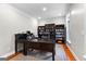 Home office with built-in bookshelves, desk, and natural light at 654 Cannon Rd, Sharpsburg, GA 30277