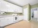 Well-maintained kitchen with white cabinetry and standard appliances at 9135 Woodhaven Way, Mcdonough, GA 30253