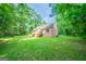 Sprawling backyard providing room to roam along with an elevated wooden deck at 70 Sylvia Cir, Covington, GA 30016