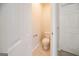 Neutral half bathroom features a tile floor and standard toilet at 70 Sylvia Cir, Covington, GA 30016