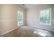 Bedroom with neutral walls and carpet, plus two windows for natural light at 70 Sylvia Cir, Covington, GA 30016