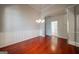 Dining room features classic wainscoting, elegant chandelier, and a hardwood floor at 70 Sylvia Cir, Covington, GA 30016