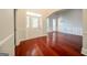 Welcoming entryway with hardwood floors, decorative door and an arched entrance at 70 Sylvia Cir, Covington, GA 30016