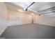 Finished two car garage offering clean floors, an entry door, garage door openers, and lighting at 70 Sylvia Cir, Covington, GA 30016