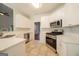 Bright kitchen featuring white cabinets, quartz countertops, and stainless steel appliances at 70 Sylvia Cir, Covington, GA 30016