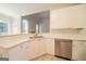 Well-lit kitchen with quartz countertops, stainless steel appliances and an open floor plan at 70 Sylvia Cir, Covington, GA 30016