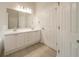 Bathroom features double vanity with cabinet storage and tile flooring at 70 Sylvia Cir, Covington, GA 30016