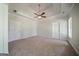 Spacious main bedroom featuring ceiling fan and ample natural light at 70 Sylvia Cir, Covington, GA 30016