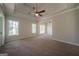 Spacious main bedroom featuring ceiling fan and large windows, offering a serene retreat at 70 Sylvia Cir, Covington, GA 30016