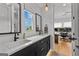 Modern bathroom features double sinks, sleek black hardware, and an adjacent office at 185 Central Ave, Fayetteville, GA 30214