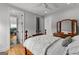 Well-lit bedroom offers hardwood floors and a traditional style dresser at 185 Central Ave, Fayetteville, GA 30214