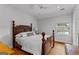 Bright bedroom features hardwood floors, a ceiling fan, and a window for natural light at 185 Central Ave, Fayetteville, GA 30214