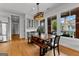 Modern dining room with a wood table, bench seating, and nearby kitchen with stainless steel refrigerator at 185 Central Ave, Fayetteville, GA 30214