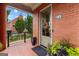 Welcoming entrance with a decorative wreath, brick detail, and manicured plants at 185 Central Ave, Fayetteville, GA 30214