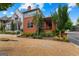An elegant brick home showcasing professionally landscaped yard, and a decorative water feature at 185 Central Ave, Fayetteville, GA 30214