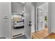 View of a white Porsche 718 Cayman GTS in a clean and organized garage at 185 Central Ave, Fayetteville, GA 30214