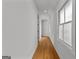 Bright hallway with hardwood floors and white walls, with windows providing natural light at 185 Central Ave, Fayetteville, GA 30214