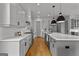 Modern kitchen features white subway tiles, stainless steel appliances, and gray cabinets at 185 Central Ave, Fayetteville, GA 30214