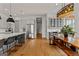 Bright, open kitchen with stainless appliances, large island with seating, and light wood flooring at 185 Central Ave, Fayetteville, GA 30214