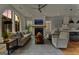 Cozy living room with modern decor, fireplace, and hardwood floors, perfect for relaxation and entertaining at 185 Central Ave, Fayetteville, GA 30214