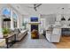 Bright living room boasts an arched window, fireplace, and hardwood floors creating a relaxing ambiance at 185 Central Ave, Fayetteville, GA 30214