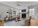 Bright and modern living room with a fireplace and arched windows offer a comforting atmosphere at 185 Central Ave, Fayetteville, GA 30214